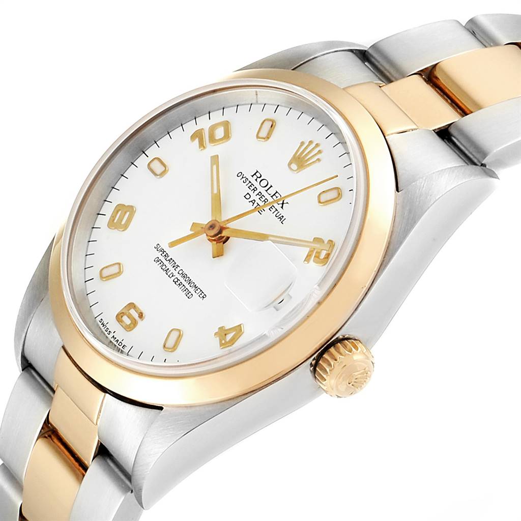 This image shows a Rolex Date 15203 Men's Steel and Gold (two tone) White Dial 15203 Men's Steel and Gold (two tone) White Dial model watch at an angled close-up, highlighting the dial, case, bezel, crown, and part of the bracelet.