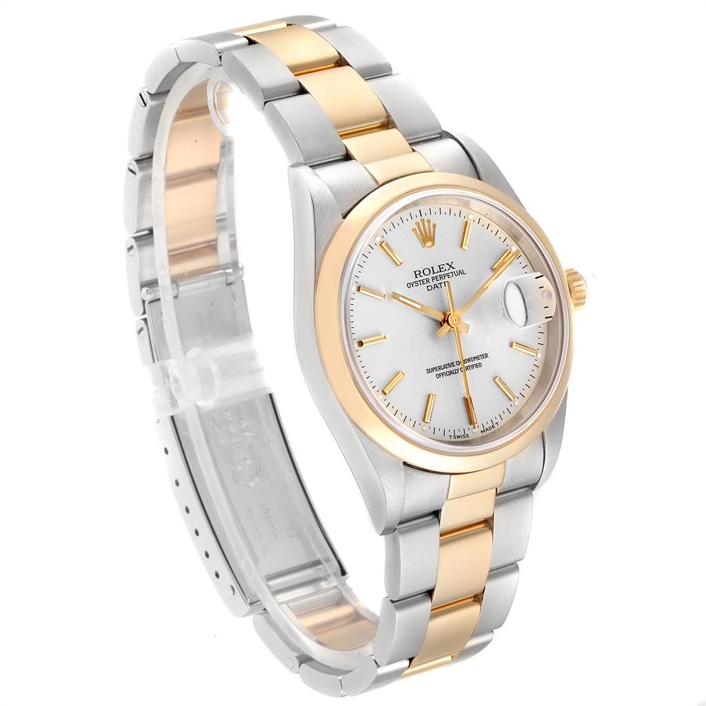 This image displays a Rolex Date 15203 Men's Steel and Gold (two tone) Silver Dial 15203 Men's Steel and Gold (two tone) Silver Dial model watch at a three-quarter angle showcasing the dial, bezel, and part of the bracelet.