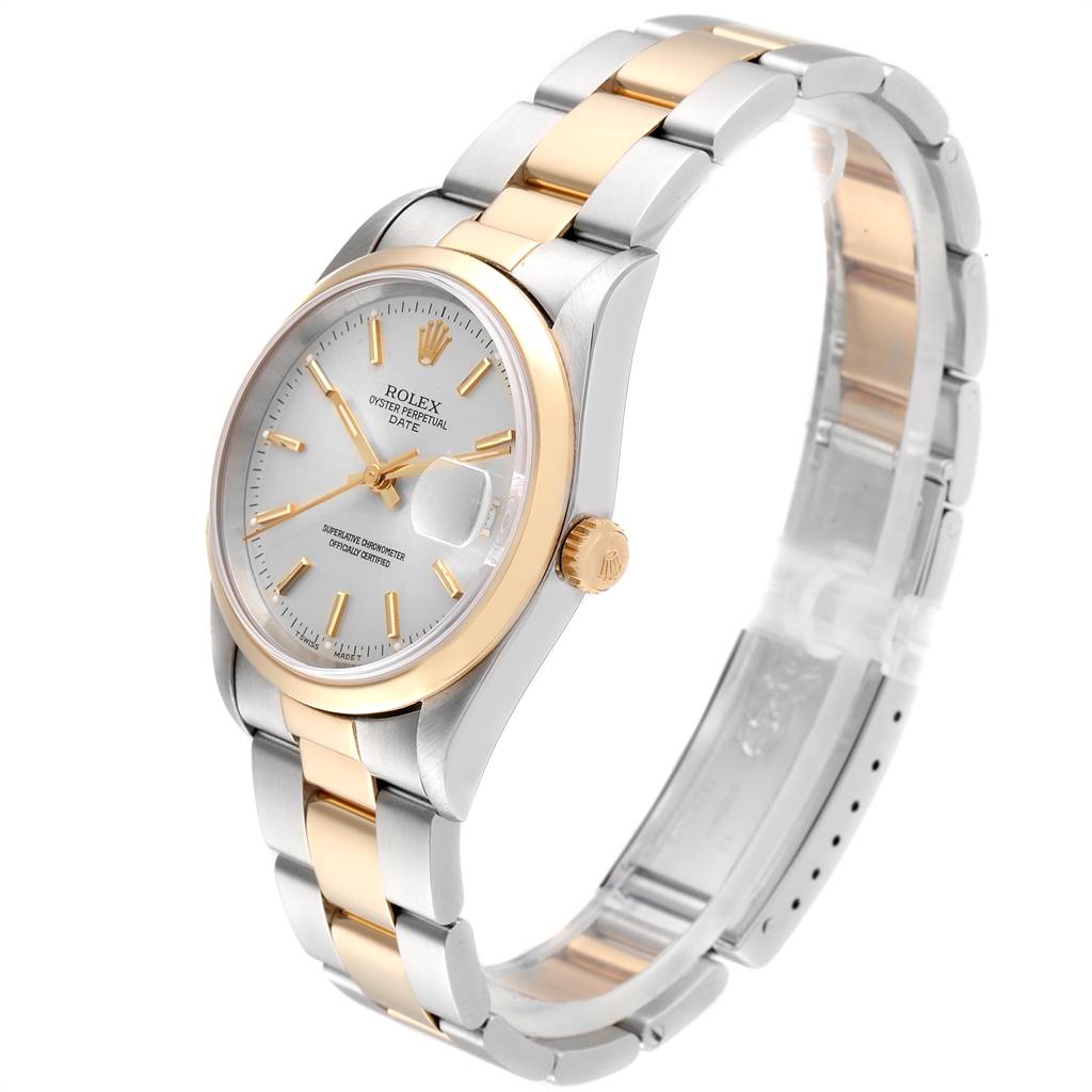 This image shows a side angle view of a Rolex Date 15203 Men's Steel and Gold (two tone) Silver Dial 15203 Men's Steel and Gold (two tone) Silver Dial model watch, highlighting the face, crown, and two-tone bracelet.