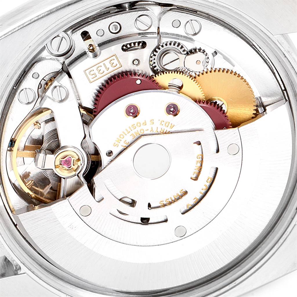 This image shows a close-up of the movement mechanism inside a Rolex Date 115200 Men's Stainless Steel Black Dial 115200 Men's Stainless Steel Black Dial model watch.
