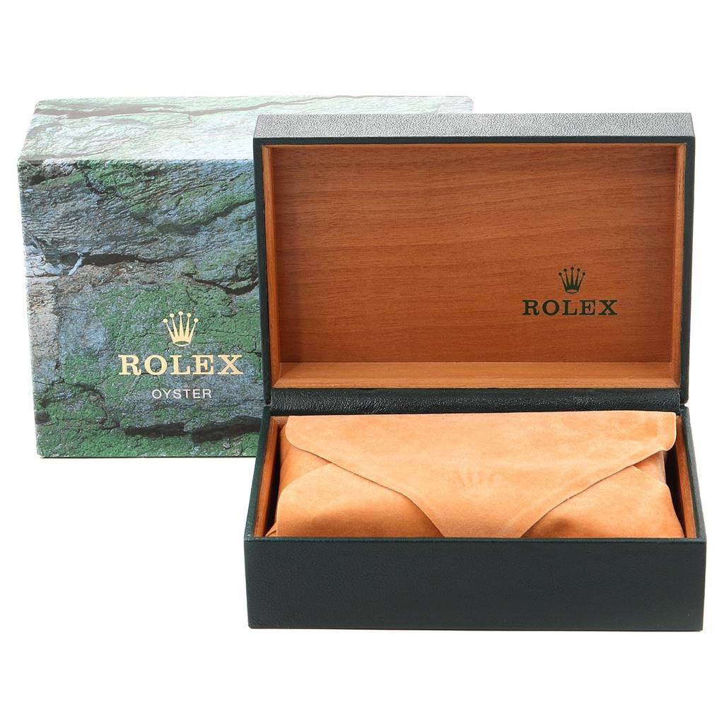 The image shows an open Rolex Date 15203 Men's Steel and Gold (two tone) White Dial 15203 Men's Steel and Gold (two tone) White Dial model watch box, displaying the inner wooden lining and a velvet pouch, with the outer packaging in the background.