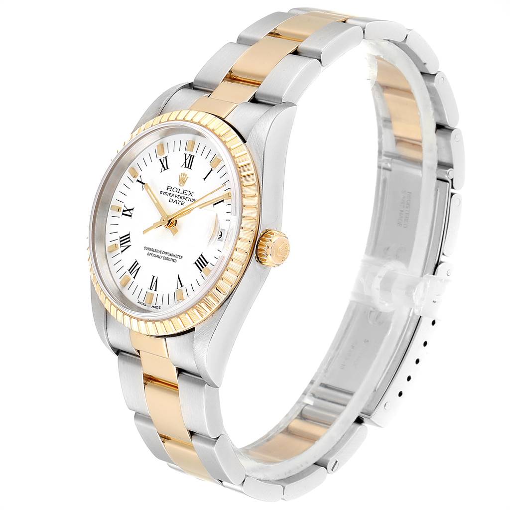 The image shows a Rolex Date 15223 Men's Steel and Gold (two tone) White Dial 15223 Men's Steel and Gold (two tone) White Dial model watch at a three-quarter angle, highlighting the two-tone band, fluted bezel, and white dial with Roman numerals.