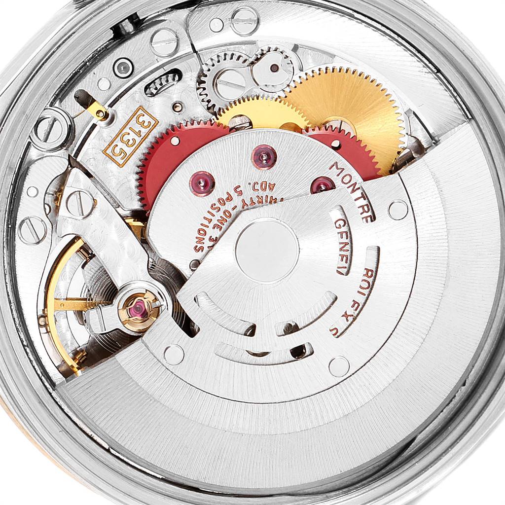 This is a close-up view of the movement and inner mechanisms of a Rolex Date 15223 Men's Steel and Gold (two tone) White Dial 15223 Men's Steel and Gold (two tone) White Dial model watch.