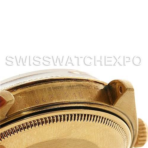 The image shows a close-up of the side of a Rolex Date 1503 Men
s Yellow Gold Champagne Dial 1503 Men
s Yellow Gold Champagne Dial model watch, highlighting part of the case and the serial number.