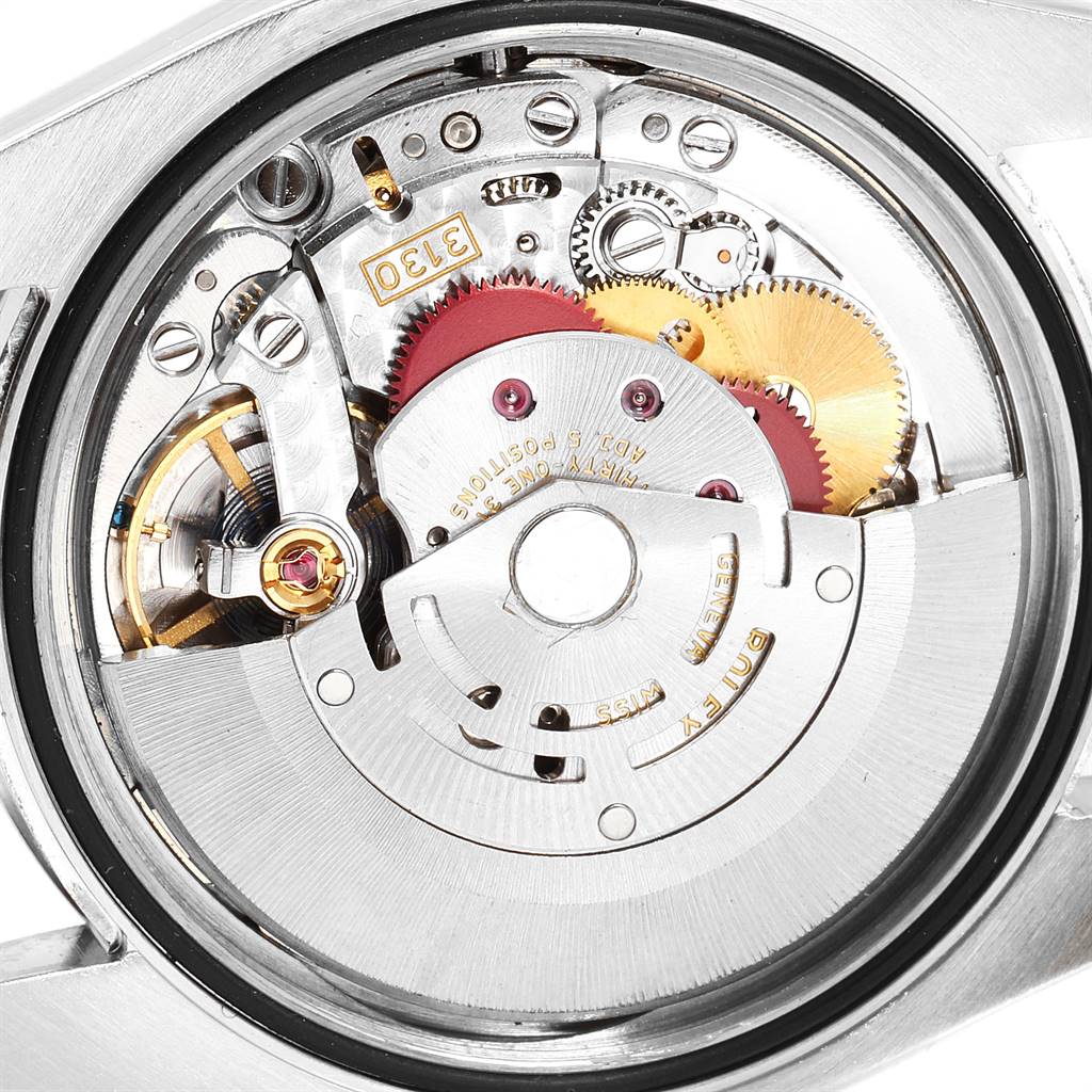 This image shows the intricate inner mechanism of a Rolex Date 116000 Men's Stainless Steel Blue Dial 116000 Men's Stainless Steel Blue Dial model watch from a rear, close-up angle.