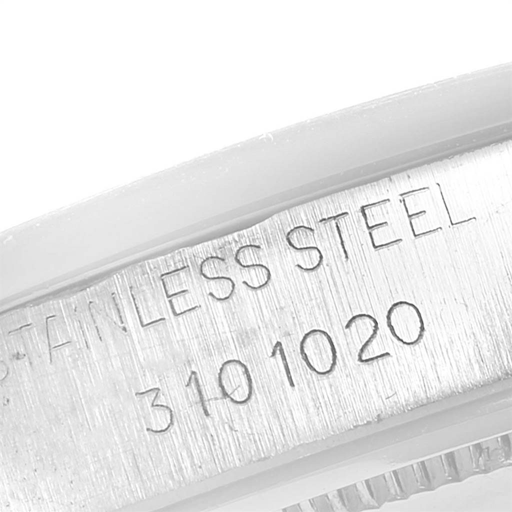 The image shows a close-up of the case back inscribed with "STAINLESS STEEL 3101020" from the Rolex Date 6694 Men's Stainless Steel Silver Dial 6694 Men's Stainless Steel Silver Dial model.
