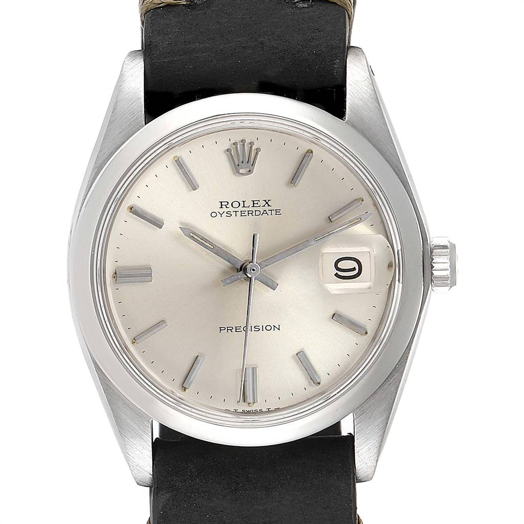 The image shows a frontal view of a Rolex Oysterdate Precision watch, highlighting the dial, hands, crown, and date window.