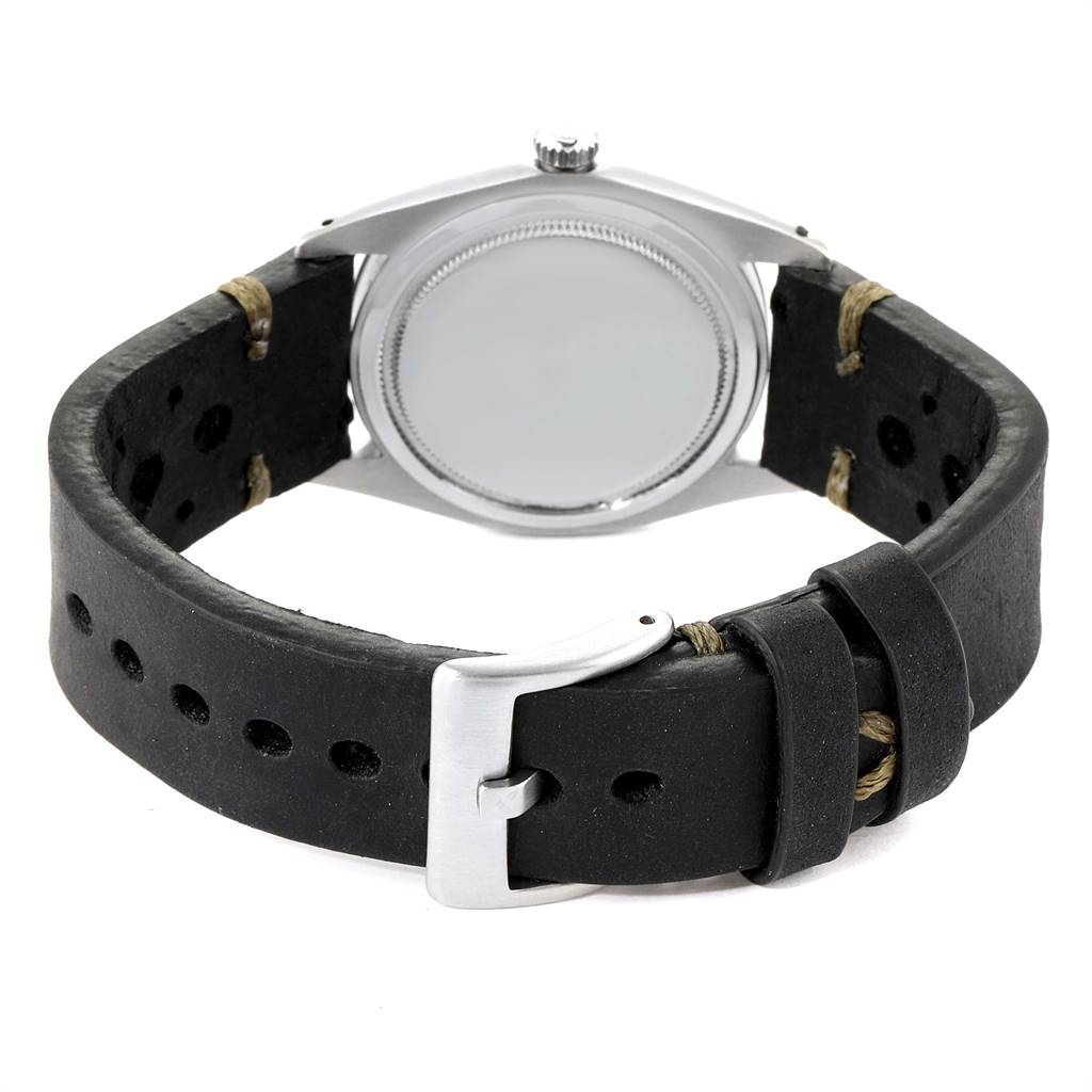 The image shows the back of a Rolex Date 6694 Men's Stainless Steel Silver Dial 6694 Men's Stainless Steel Silver Dial model watch, highlighting its case back and black leather strap with a buckle.