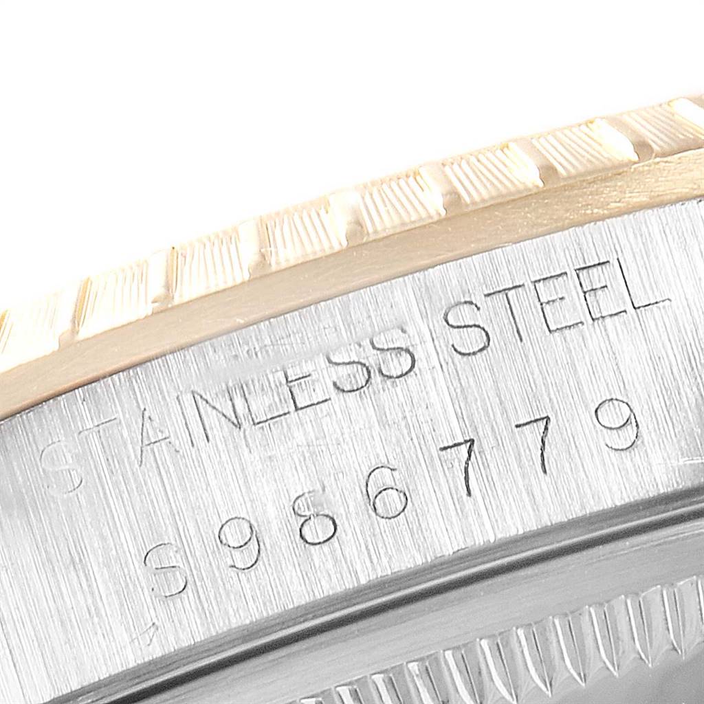 This close-up image shows the stainless steel casing and partial bezel of a Rolex Date 15223 Men's Steel and Gold (two tone) White Dial 15223 Men's Steel and Gold (two tone) White Dial model watch.