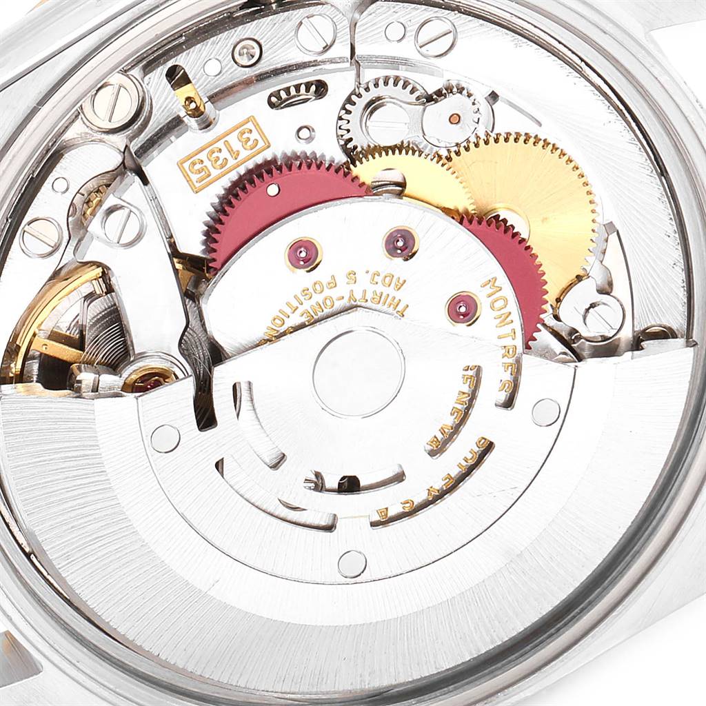This image shows the intricate inner mechanics of a Rolex Date 15223 Men's Steel and Gold (two tone) White Dial 15223 Men's Steel and Gold (two tone) White Dial model watch, highlighting gears and movement components.