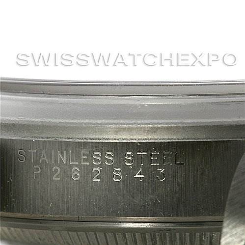 The image shows a close-up angle of the serial number and "Stainless Steel" engraving on a Rolex Date 15200 Men's Stainless Steel Silver Dial 15200 Men's Stainless Steel Silver Dial model watch.