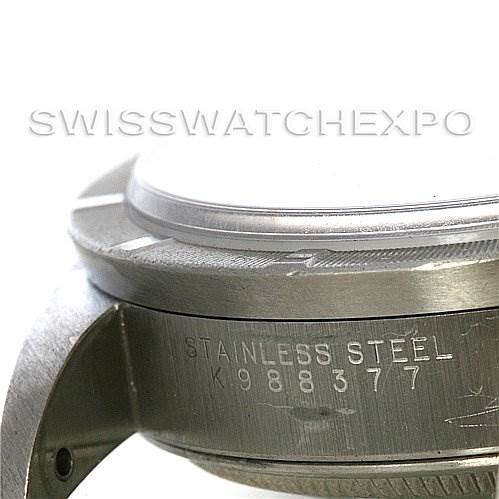 The image shows a close-up side view of the stainless steel case and lugs of a Rolex Date 15210 Men's Stainless Steel Blue Dial 15210 Men's Stainless Steel Blue Dial model watch, highlighting its serial number.