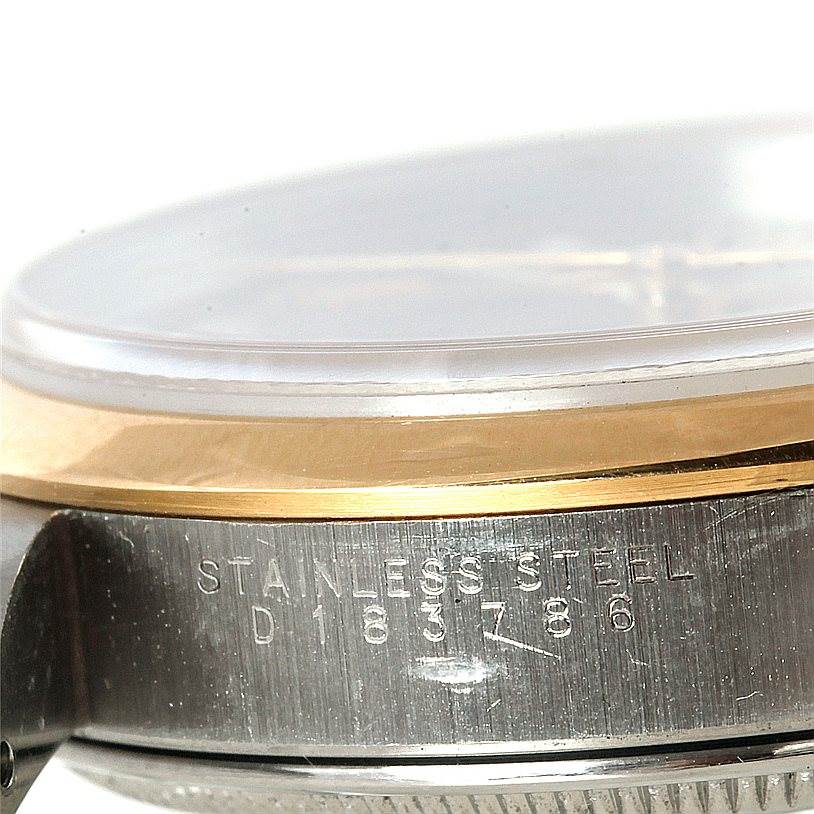 An angled shot showing the side of the Rolex Date 15203 Men's Steel and Gold (two tone) Grey Dial 15203 Men's Steel and Gold (two tone) Grey Dial model, revealing the stainless steel case and part of the gold bezel.