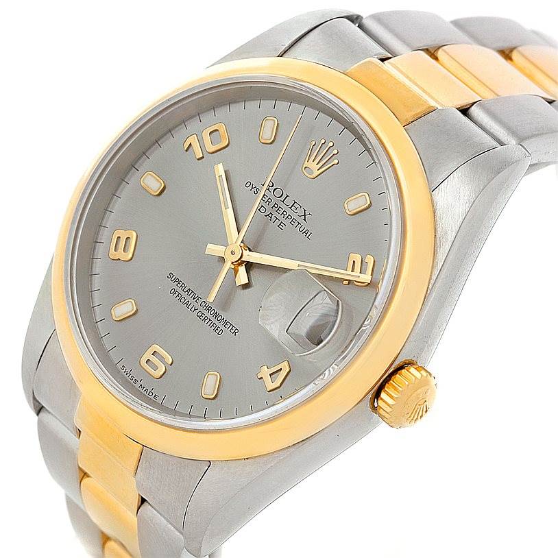 This image shows a Rolex Date 15203 Men's Steel and Gold (two tone) Grey Dial 15203 Men's Steel and Gold (two tone) Grey Dial model watch at a slight angle, highlighting the face, bezel, crown, and part of the bracelet.