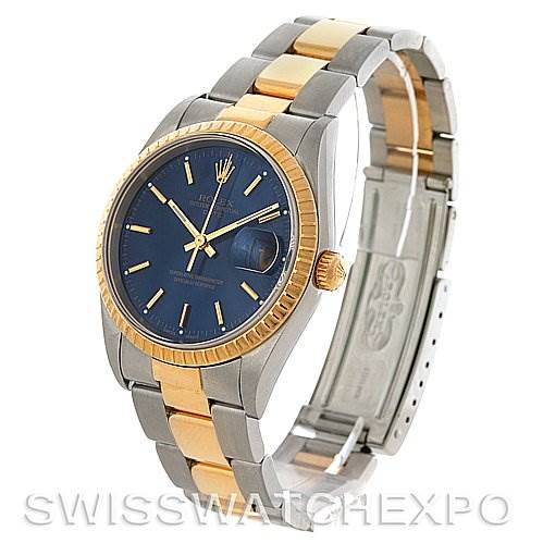This image shows a Rolex Date 15223 Men's Steel and Gold (two tone) Blue Dial 15223 Men's Steel and Gold (two tone) Blue Dial model watch at a three-quarter angle, highlighting its blue dial, two-tone bracelet, and fluted bezel.