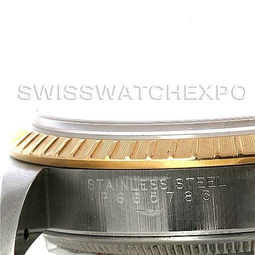 This image shows a close-up side angle of a Rolex Date 15223 Men's Steel and Gold (two tone) Blue Dial 15223 Men's Steel and Gold (two tone) Blue Dial model watch, highlighting the bezel and part of the case.