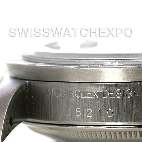 The image shows a close-up side view of the case of a Rolex Date 15210 Men's Stainless Steel Black Dial 15210 Men's Stainless Steel Black Dial model watch, highlighting the model number "15210" and engraving "ORIG ROLEX DESIGN."