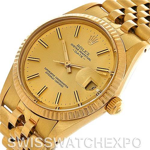 This image shows a Rolex Date 15037 Men's Yellow Gold Champagne Dial 15037 Men's Yellow Gold Champagne Dial model watch from an oblique angle, revealing the dial, bezel, date window, and part of the bracelet.