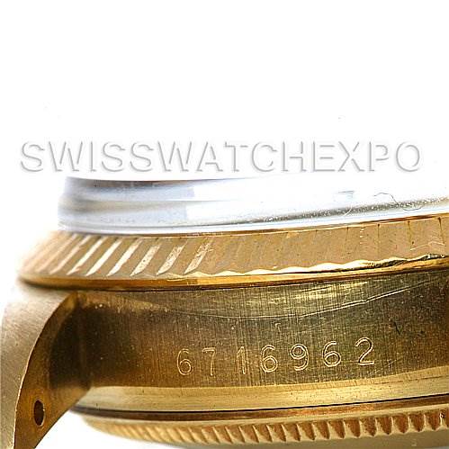 The image shows a close-up side view of a Rolex Date 15037 Men's Yellow Gold Champagne Dial 15037 Men's Yellow Gold Champagne Dial model's watch case with the serial number engraved.