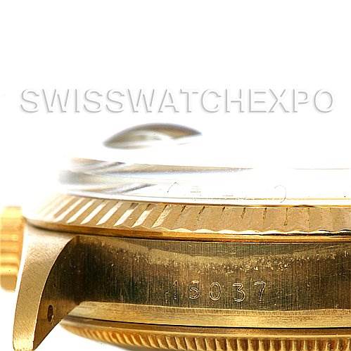 This image shows a close-up side view of a Rolex Date 15037 Men's Yellow Gold Champagne Dial 15037 Men's Yellow Gold Champagne Dial model watch case, bezel, and crown with the serial number visible.