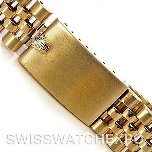 This image shows a close-up of the clasp on a Rolex Date 15037 Men's Yellow Gold Champagne Dial 15037 Men's Yellow Gold Champagne Dial model watch bracelet.