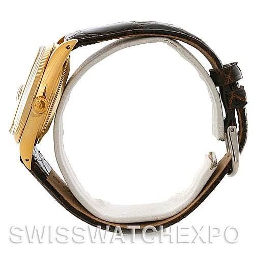 This image shows a side view of a Rolex Date 15037 Men's Yellow Gold Champagne Dial 15037 Men's Yellow Gold Champagne Dial model watch, featuring its gold case, crown, and leather strap.