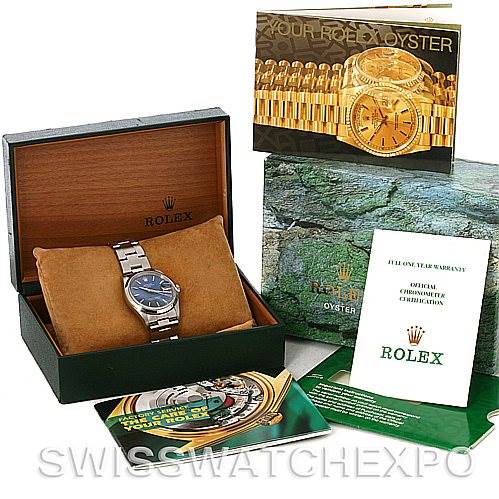 The image shows a Rolex Date 15200 Men's Stainless Steel Blue Dial 15200 Men's Stainless Steel Blue Dial model watch in its box, along with various booklets and warranty papers.
