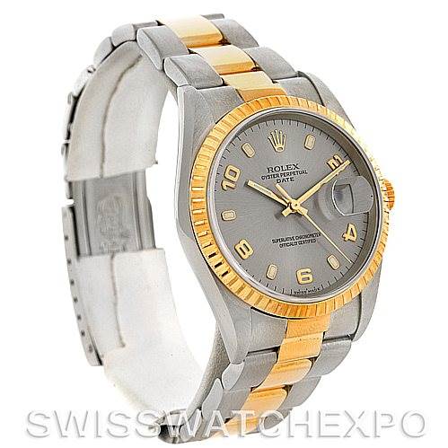 The image shows a partial side view of a Rolex Date 15223 Men's Steel and Gold (two tone) Grey Dial 15223 Men's Steel and Gold (two tone) Grey Dial model, highlighting its two-tone bracelet, fluted bezel, and dial.