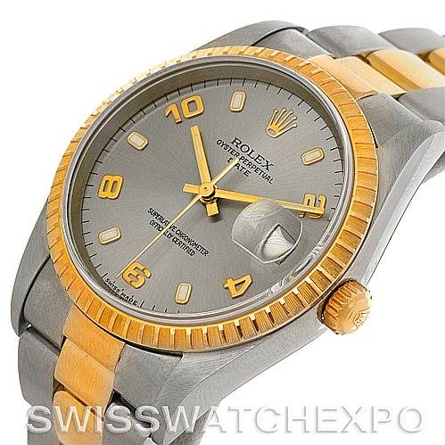 This image shows a Rolex Date 15223 Men's Steel and Gold (two tone) Grey Dial 15223 Men's Steel and Gold (two tone) Grey Dial model watch viewed from an angle highlighting the dial, bezel, crown, and bracelet.