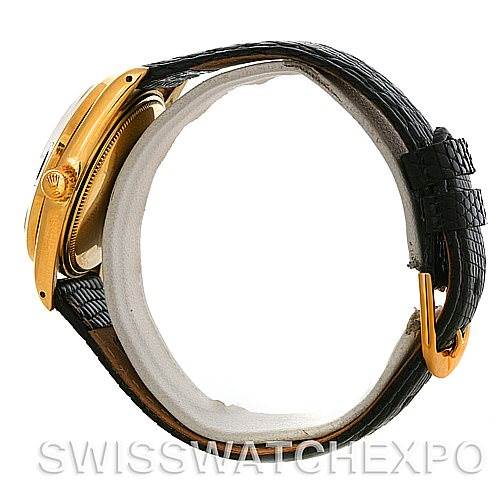 The image shows a side view of a Rolex Date 1503 Men
s Yellow Gold Black Dial 1503 Men
s Yellow Gold Black Dial watch, highlighting its gold case, crown, and black leather strap with a gold buckle.