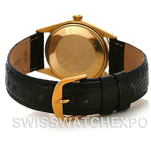 This image shows the back case and black leather strap with a gold buckle of a Rolex Date 1503 Men
s Yellow Gold Black Dial 1503 Men
s Yellow Gold Black Dial model watch.