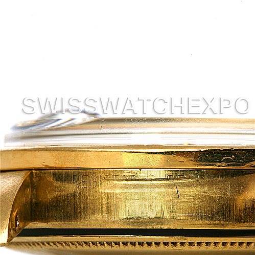 The image shows a close-up side view of the case and bezel of a Rolex Date 1503 Men
s Yellow Gold Black Dial 1503 Men
s Yellow Gold Black Dial model watch.