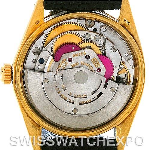 This image shows the internal mechanical movement of a Rolex Date 1503 Men
s Yellow Gold Black Dial 1503 Men
s Yellow Gold Black Dial model watch from the rear angle, highlighting the rotor and gears.