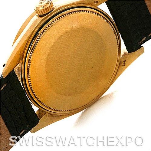 The image shows the case back and part of the band of a Rolex Date 1503 Men
s Yellow Gold Black Dial 1503 Men
s Yellow Gold Black Dial model watch from a side angle.