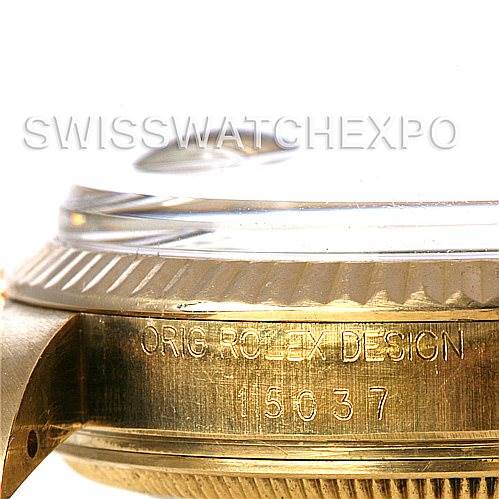 This close-up image shows the side of the Rolex Date 15037 Men's Yellow Gold Champagne Dial 15037 Men's Yellow Gold Champagne Dial model, featuring the engraved serial number and part of the watch bezel and case.