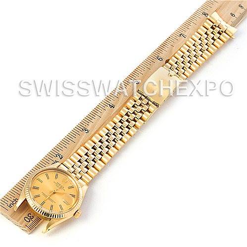 The image shows a Rolex Date 15037 Men's Yellow Gold Champagne Dial 15037 Men's Yellow Gold Champagne Dial model watch in gold, laid flat next to a ruler for size reference.