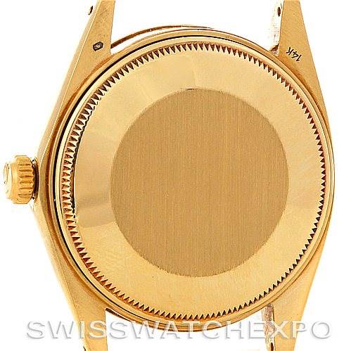This image shows the back case and crown of a Rolex Date 1503 Men's Yellow Gold Champagne Dial 1503 Men's Yellow Gold Champagne Dial model watch from a rear perspective.