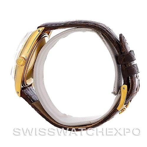 This image shows a side view of the Rolex Date 1503 Men's Yellow Gold Champagne Dial 1503 Men's Yellow Gold Champagne Dial model, focusing on the crown, case, and leather strap.