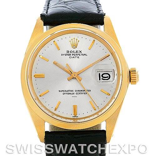 This image shows a front view of a Rolex Oyster Perpetual Date watch with a gold case and black leather strap.
