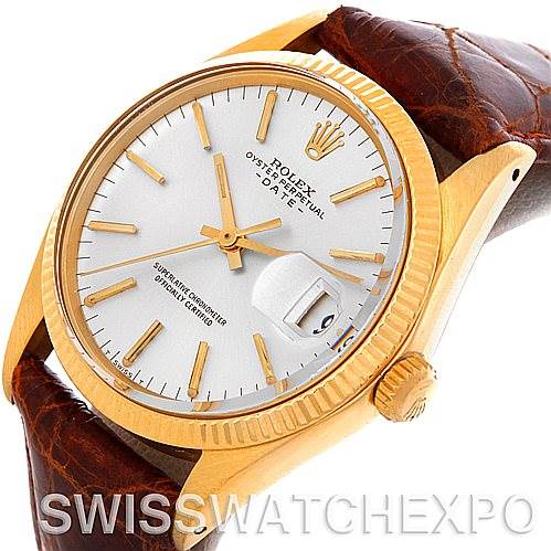 This image shows a frontal angle of a Rolex Date 1503 Men's Yellow Gold Silver Dial 1503 Men's Yellow Gold Silver Dial watch, highlighting its gold bezel, brown leather strap, and the date window.