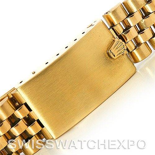 This image shows the clasp and part of the bracelet of a Rolex Date 1503 Men's Yellow Gold Silver Dial 1503 Men's Yellow Gold Silver Dial model watch, featuring a gold Jubilee band.