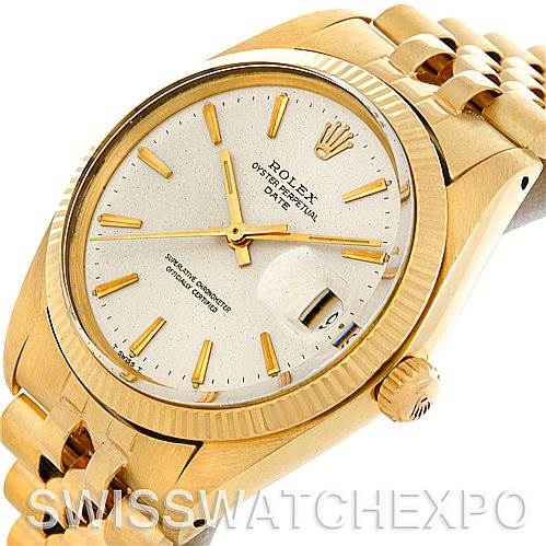 This image shows a close-up, angled view of the dial and part of the gold bracelet of a Rolex Date 1503 Men's Yellow Gold Silver Dial 1503 Men's Yellow Gold Silver Dial model watch.