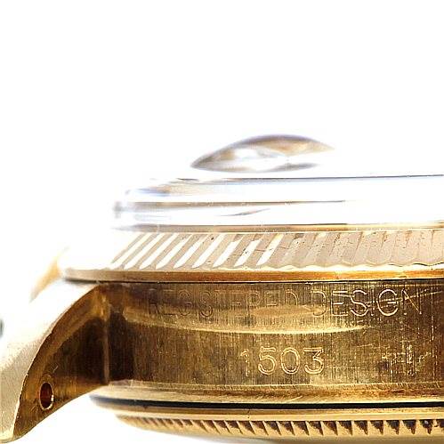 This image shows a close-up side view of the Rolex Date 1503 Men's Yellow Gold Champagne Dial 1503 Men's Yellow Gold Champagne Dial model watch, highlighting the case and bezel with engraved text.