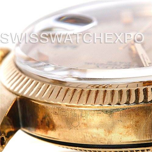 This close-up image shows the side and bezel of a Rolex Date 1503 Men's Yellow Gold Champagne Dial 1503 Men's Yellow Gold Champagne Dial model watch.