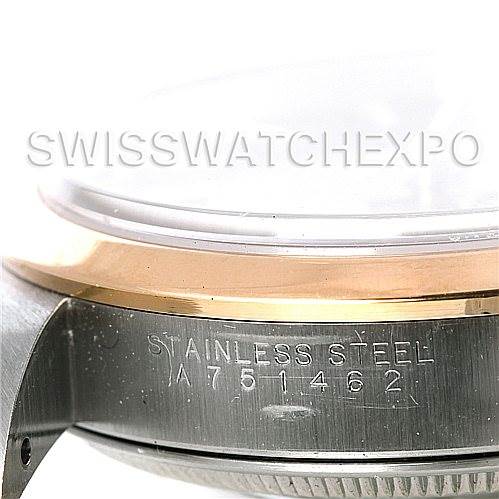 This image shows a close-up of the side of the Rolex Date 15203 Men's Steel and Gold (two tone) Black Dial 15203 Men's Steel and Gold (two tone) Black Dial model watch, highlighting the case and serial number engraving.