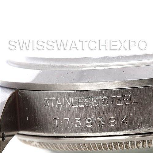 The image shows a close-up of the side of a Rolex Date 15200 Men's Stainless Steel Black Dial 15200 Men's Stainless Steel Black Dial model watch, highlighting the stainless steel casing and serial number.
