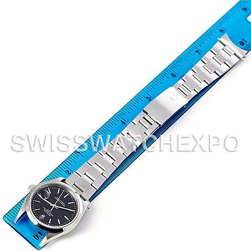 The image shows a full-length view of a Rolex Date 15200 Men's Stainless Steel Black Dial 15200 Men's Stainless Steel Black Dial model watch, with its bracelet laid out against a ruler for measurement.