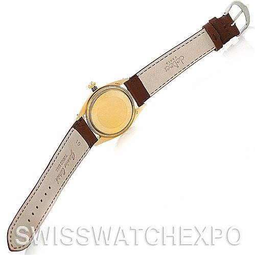 This image shows the back view of a Rolex Date 1503 Men's Yellow Gold Silver Dial 1503 Men's Yellow Gold Silver Dial model watch with its strap fully extended.