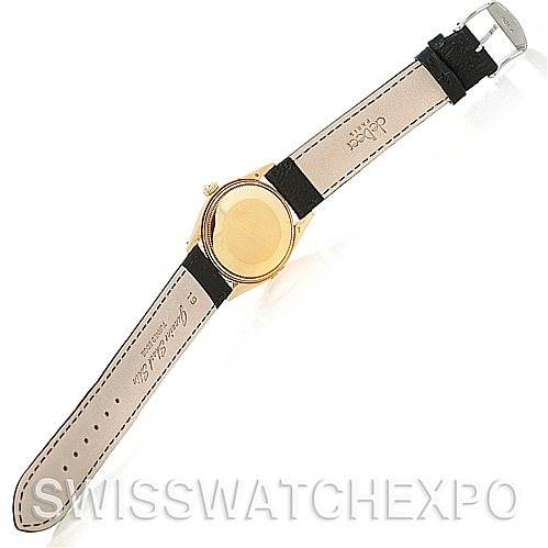 This image shows the back and strap of a Rolex Date 1503 Men's Yellow Gold Champagne Dial 1503 Men's Yellow Gold Champagne Dial model watch, displayed from a top-down angle.