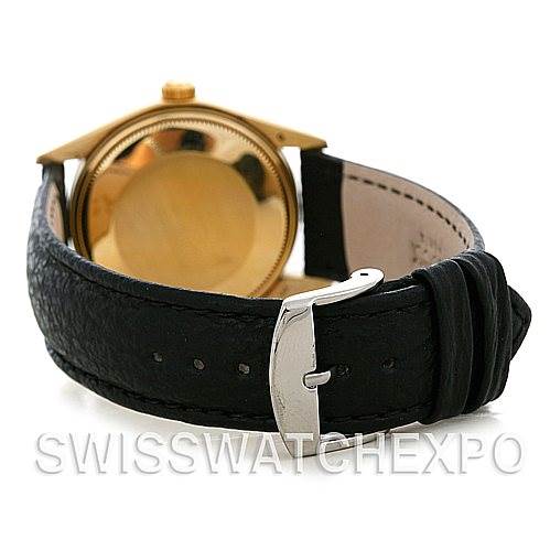 This image shows the rear view of a Rolex Date 1503 Men's Yellow Gold Champagne Dial 1503 Men's Yellow Gold Champagne Dial model, including the case back and black leather strap with a silver buckle.